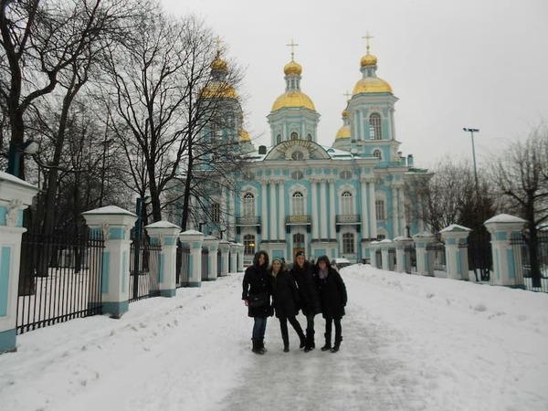 Three Students In Front Of A Building In Russia